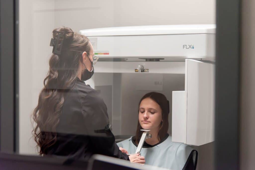 Patient receiving digital dental x ray for clear aligner treatment at a top rated expert orthodontic practice in columbia and waterloo